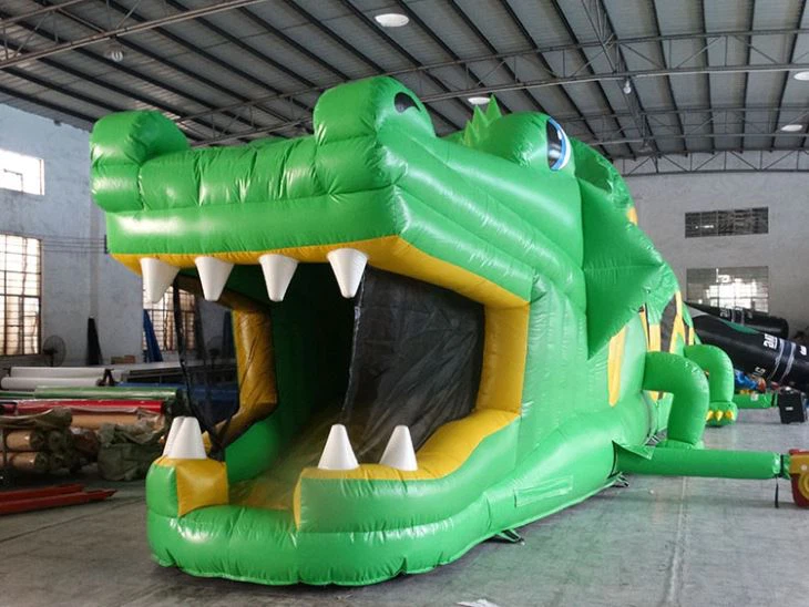 green crocodile inflatable obstacle course